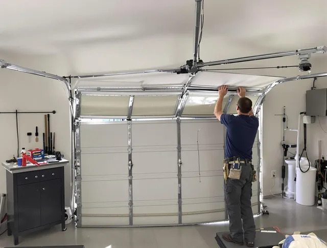 Westerly Garage Door Repair specialist performing precise section replacement on Westerly garage door